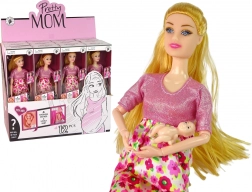 Trudna lutka u ružičastoj haljini s cvijećem