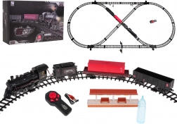 Vlakna staza s lokomotivom koja dimi, svjetlom i glazbom