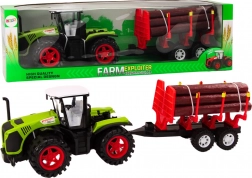 Zeleni farmerski traktor s prikolicom za trupce