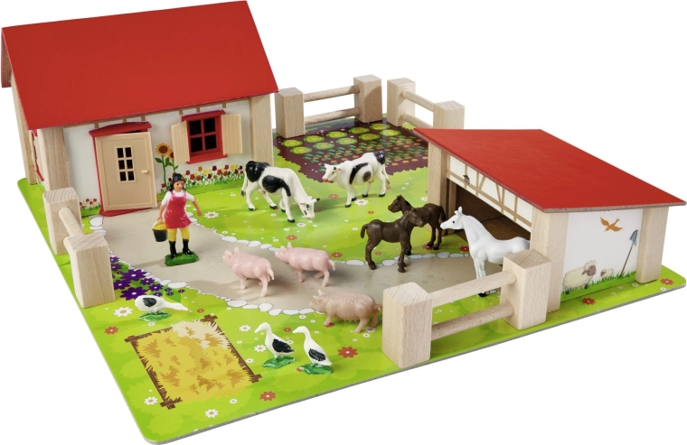 Stabilne drvene zgrade s crvenim krovom