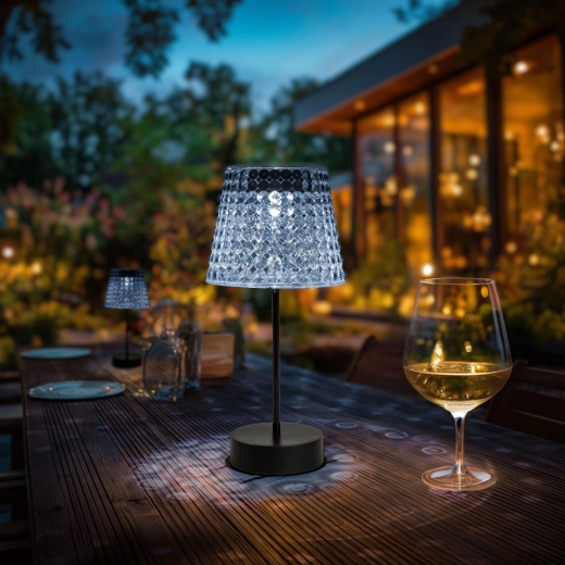 Damaged solar table lamp with transparent shade and cool white LED