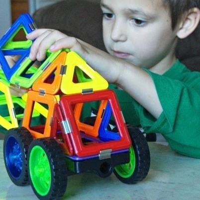 Magnetic building in motion
