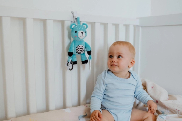 Soft teddy bear with a gentle rattle