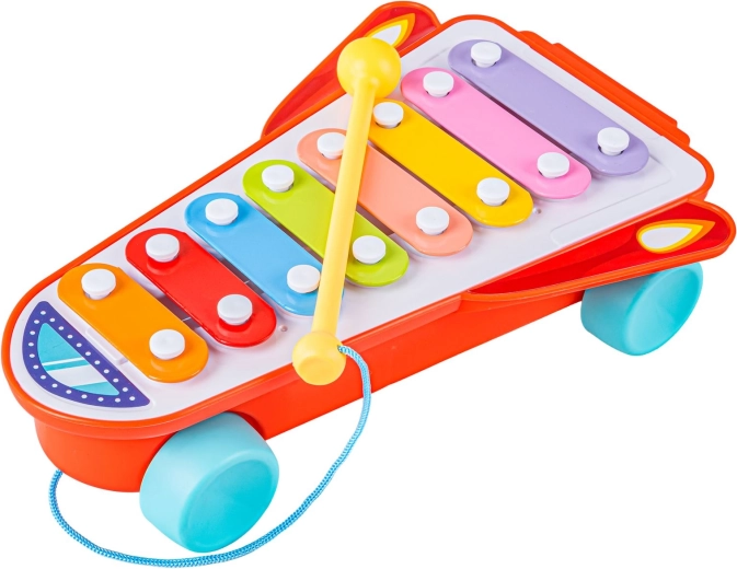On wheels and with a mallet on a string