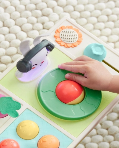 Spinning “turntable” and controls for cause-and-effect play