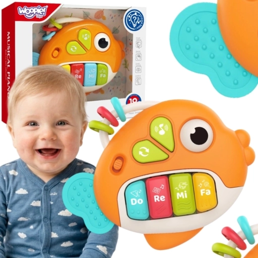 Woopie baby interaktivna klavirska ribica sa zvukovima i svjetlom 18 mj.+