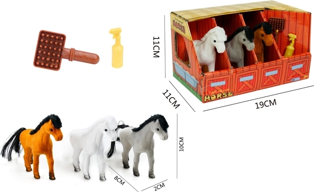 Three ponies in a stable with accessories