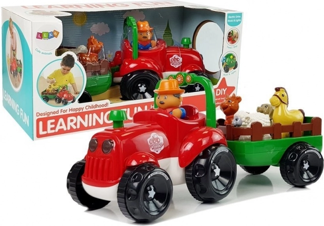 Glazbeni traktor s prikolicom i životinjama na baterije