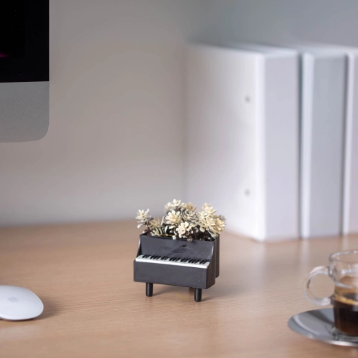 Artificial plant in a piano-shaped flowerpot - 1 piece