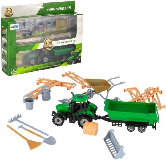 Traktor s prikolicom i farmerskim priborom