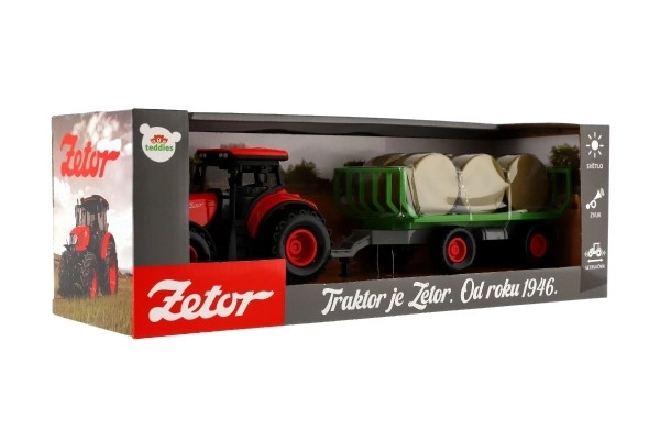 Traktor Zetor s prikolicom i balama plastike 36cm na inerciju na bat. sa svjetlom i zvukom u kutiji 39x13