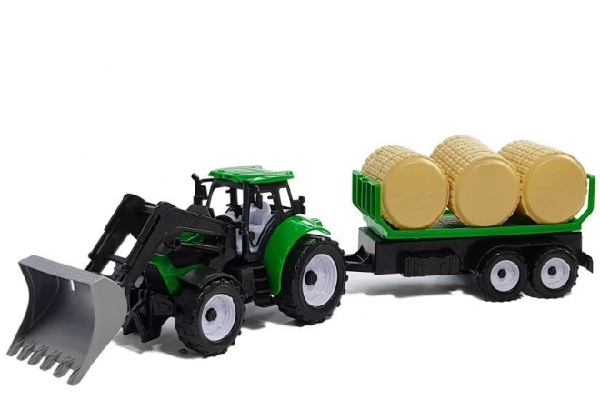 Traktor s prikolicom za bale sijena Cisterna
