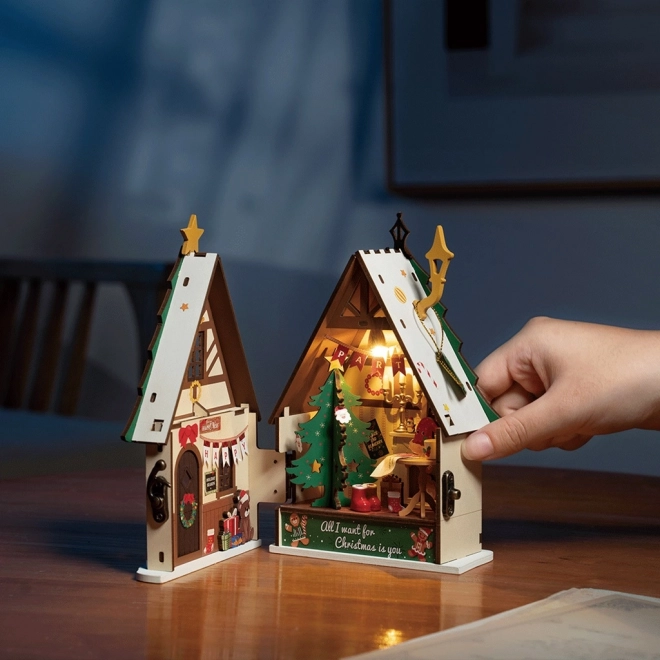 Miniatura svjetleće božićne kućice