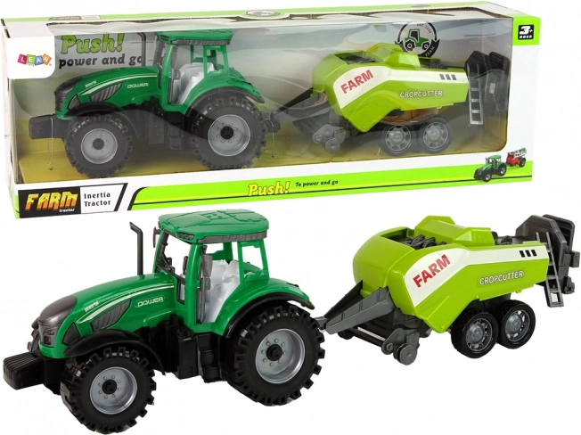 Zeleni traktor s kosilicom na zamašnjak