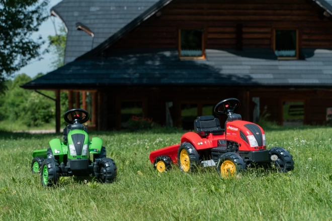 Pedalni traktor s prikolicom crveni