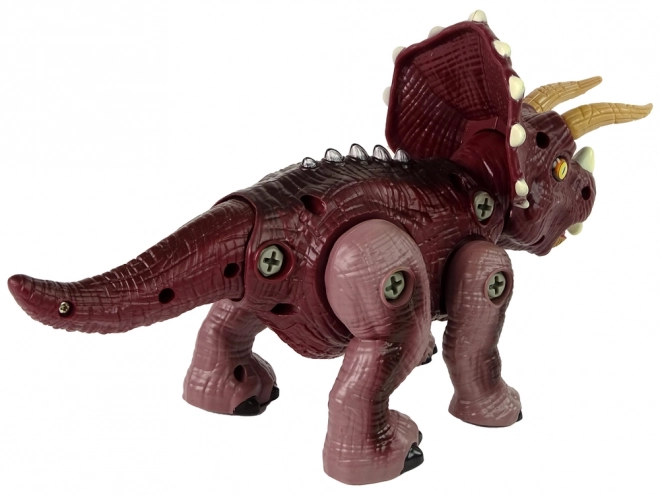 Plastični dinosaurus na sklapanje s bušilicom