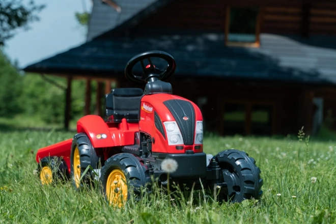 Pedalni traktor s prikolicom crveni