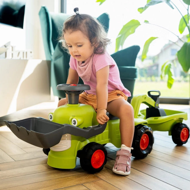Vozeći traktor Claas s prikolicom, utovarivačem i lopatom