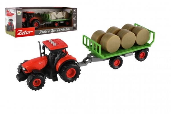 Traktor Zetor s prikolicom i balama plastike 36cm na inerciju na bat. sa svjetlom i zvukom u kutiji 39x13