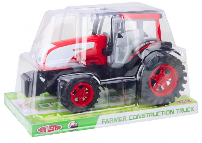 Veliki poljoprivredni traktor s pogonom crveni