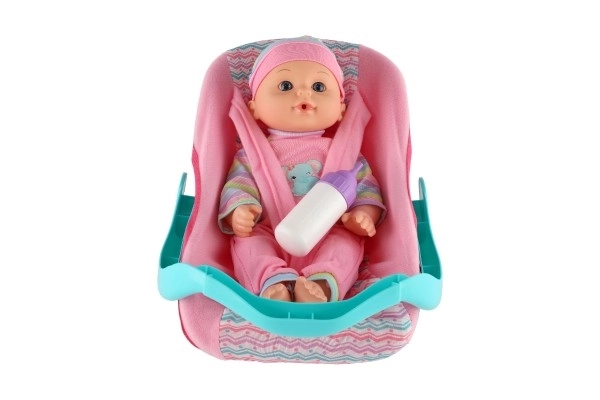 Lutka beba 30cm plastika u nosiljci/autosjedalici s bočicom u blisteru