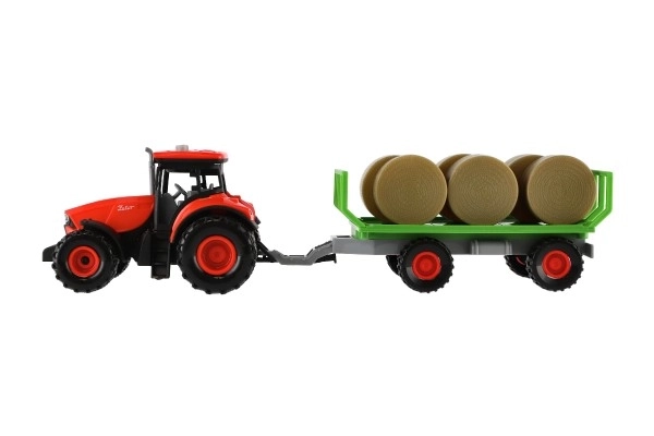 Traktor Zetor s prikolicom i balama plastike 36cm na inerciju na bat. sa svjetlom i zvukom u kutiji 39x13
