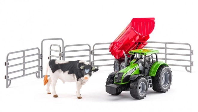 Traktor s prikolicom i bikom s vrtom