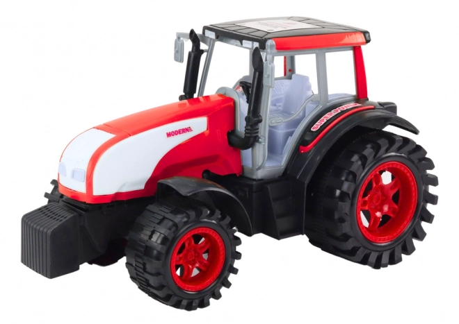 Veliki poljoprivredni traktor s pogonom crveni