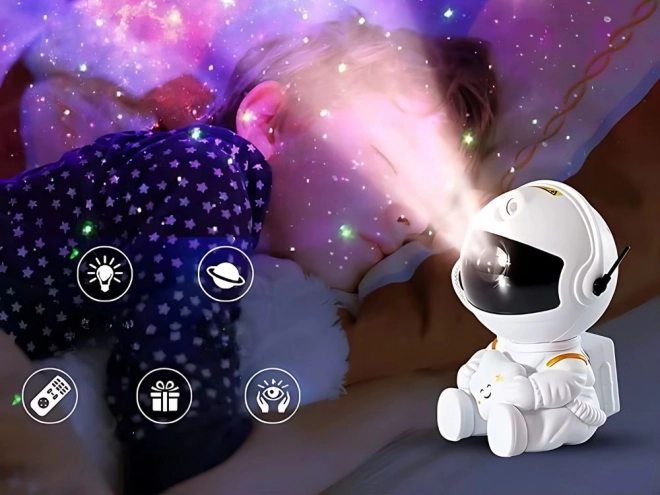 Zvjezdani projektor sjedeći astronaut s daljinskim upravljačem