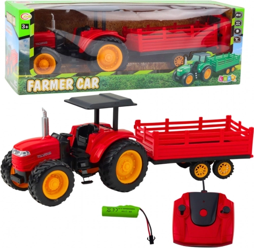 Daljinski upravljani farmerski traktor s prikolicom crveni