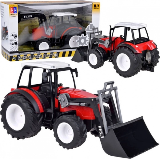 Veliki crveni traktor s pokretnom rukom i velikim kotačima