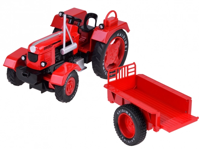 Crveni metalni traktor s gumenim kotačima 1:18