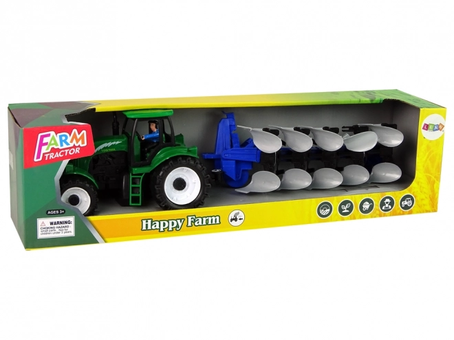 Zeleni poljoprivredni traktor s plugom