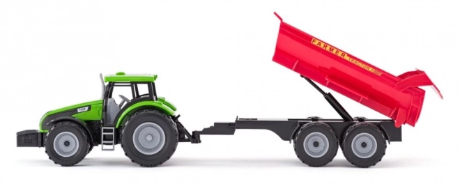 Traktor s prikolicom i bikom s vrtom