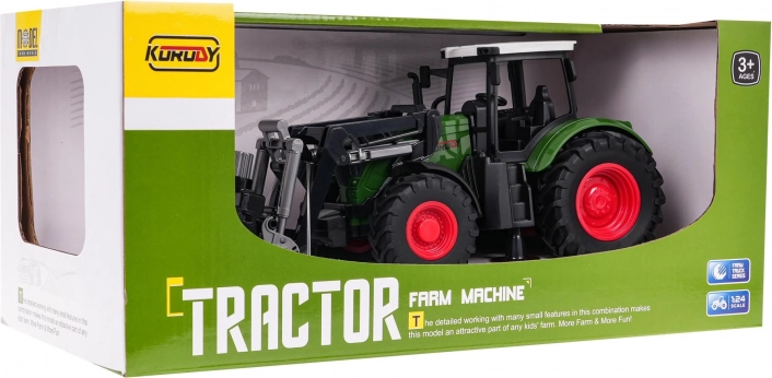 Zeleni traktor s hvataljkom