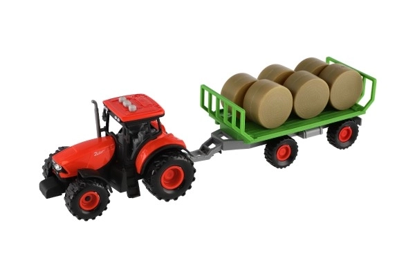 Traktor Zetor s prikolicom i balama plastike 36cm na inerciju na bat. sa svjetlom i zvukom u kutiji 39x13