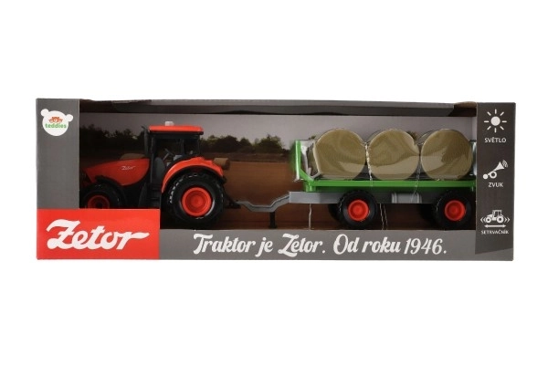 Traktor Zetor s prikolicom i balama plastike 36cm na inerciju na bat. sa svjetlom i zvukom u kutiji 39x13