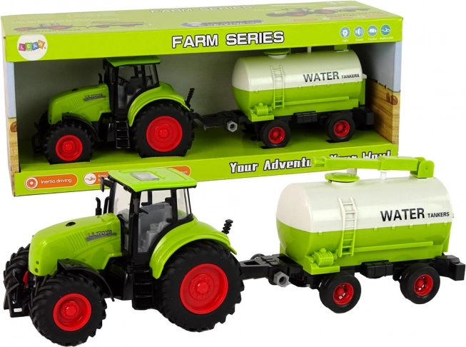 Zeleni traktor s prikolicom na velikim kotačima