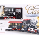 Klasična željeznička pruga s lokomotivom koja ispušta dim