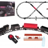 Vlakna staza s lokomotivom koja dimi, svjetlom i glazbom